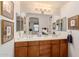 This bathroom has double sinks, plenty of cabinet space, and a large mirror at 13300 E Via Linda -- # 1065, Scottsdale, AZ 85259