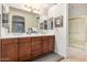 Bathroom with double sink vanity, a walk-in shower and neutral decor at 13300 E Via Linda -- # 1065, Scottsdale, AZ 85259