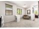 Bright bedroom with a seating area, carpeted floors, and large windows at 13300 E Via Linda -- # 1065, Scottsdale, AZ 85259