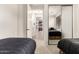Bedroom with twin beds, a mirrored closet, and neutral decor at 13300 E Via Linda -- # 1065, Scottsdale, AZ 85259