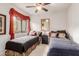 This bright bedroom features matching twin beds and decor with a large window at 13300 E Via Linda -- # 1065, Scottsdale, AZ 85259