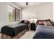 Bedroom with twin beds, neutral decor, and carpeted floors at 13300 E Via Linda -- # 1065, Scottsdale, AZ 85259