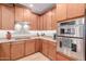 An updated kitchen with wood cabinets, stainless steel appliances, and modern countertops at 13300 E Via Linda -- # 1065, Scottsdale, AZ 85259