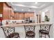 Kitchen with seating at the counter with updated appliances and fixtures at 13300 E Via Linda -- # 1065, Scottsdale, AZ 85259
