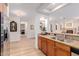 Open concept kitchen and living room with wood cabinets, stainless steel appliances, and granite countertops at 13300 E Via Linda -- # 1065, Scottsdale, AZ 85259