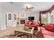 Open living room features a fireplace, TV, and comfortable seating with hardwood floors at 13300 E Via Linda -- # 1065, Scottsdale, AZ 85259