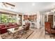 Spacious living room featuring an open concept layout with a view of the eat-in kitchen area at 13300 E Via Linda -- # 1065, Scottsdale, AZ 85259
