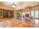 Well-appointed lounge area with tile floors, fireplace, bar, seating, and outdoor access at 13300 E Via Linda -- # 1065, Scottsdale, AZ 85259