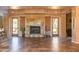 Spacious lounge area with tile flooring, stone fireplace, and outdoor access at 13300 E Via Linda -- # 1065, Scottsdale, AZ 85259