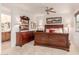 This main bedroom features dark wood furniture including a dresser and sleigh bed at 13300 E Via Linda -- # 1065, Scottsdale, AZ 85259
