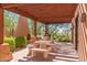 Comfortable outdoor area with desert landscape, fireplace and seating perfect for relaxation at 13300 E Via Linda -- # 1065, Scottsdale, AZ 85259