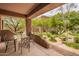 Inviting covered patio with outdoor dining area overlooking the meticulously landscaped yard at 13300 E Via Linda -- # 1065, Scottsdale, AZ 85259