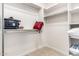 Walk-in closet with built-in shelving and carpeted floors at 13300 E Via Linda -- # 1065, Scottsdale, AZ 85259
