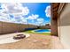 Relaxing backyard features a fire pit and a sparkling blue pool for outdoor enjoyment at 1437 W Renee Dr, Phoenix, AZ 85027