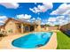 Enjoy a private backyard oasis featuring a sparkling blue pool and outdoor space at 1437 W Renee Dr, Phoenix, AZ 85027