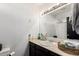 Bathroom with vanity, sink, mirror, lights, and countertop at 1437 W Renee Dr, Phoenix, AZ 85027