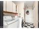 Laundry room with washer, dryer, and storage cabinets at 1437 W Renee Dr, Phoenix, AZ 85027
