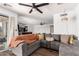 Spacious living room featuring a sectional couch with blanket and a view to the kitchen at 1437 W Renee Dr, Phoenix, AZ 85027