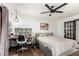 Comfortable main bedroom with a desk and workspace, ceiling fan, and neutral decor at 1437 W Renee Dr, Phoenix, AZ 85027