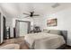 Spacious main bedroom features a ceiling fan, desk, and a sliding door for outdoor access at 1437 W Renee Dr, Phoenix, AZ 85027