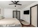 Spacious main bedroom features a ceiling fan, closet, and a television at 1437 W Renee Dr, Phoenix, AZ 85027