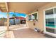 Back patio with tiled floor, covered space, and easy access to backyard amenities at 1437 W Renee Dr, Phoenix, AZ 85027