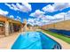 Inviting backyard pool with clear blue water and artificial turf, perfect for outdoor entertaining at 1437 W Renee Dr, Phoenix, AZ 85027