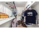 Organized walk-in closet with clothing racks, shelves, and shoes for ample storage at 1437 W Renee Dr, Phoenix, AZ 85027
