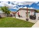Spacious backyard showcasing a well-maintained lawn, patio area, and privacy fence, ideal for outdoor activities and gatherings at 1475 E Avenida Kino --, Casa Grande, AZ 85122