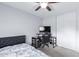 Bright bedroom with a ceiling fan, natural light, and a functional desk setup for work or study at 1475 E Avenida Kino --, Casa Grande, AZ 85122