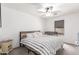 Cozy bedroom features soft carpet, a ceiling fan, and natural light from the window at 1475 E Avenida Kino --, Casa Grande, AZ 85122