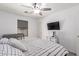 Comfortable bedroom with modern décor, plush bedding, ceiling fan, and soft natural lighting at 1475 E Avenida Kino --, Casa Grande, AZ 85122
