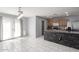 Open kitchen area with stainless steel appliances and stone accents, seamlessly connected to a bright dining space at 1475 E Avenida Kino --, Casa Grande, AZ 85122