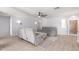 Bright living room featuring modern furniture, a ceiling fan, and tile floors throughout, bathed in natural light at 1475 E Avenida Kino --, Casa Grande, AZ 85122