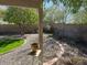 Backyard featuring decorative gravel, grassy areas, brick trim, and a block wall at 17705 N Larkspur Ln, Surprise, AZ 85374