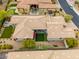 Aerial view of a private backyard with a putting green, patio, and mature landscaping at 18502 N 98Th Way, Scottsdale, AZ 85255