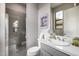 Modern bathroom with a walk-in shower, sleek vanity, and a window, offering a clean and stylish design at 18502 N 98Th Way, Scottsdale, AZ 85255