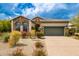 Charming single-story home with brick accents, tile roof, and well-maintained landscaping at 18502 N 98Th Way, Scottsdale, AZ 85255
