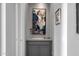 Elegant hallway featuring custom cabinets, sophisticated artwork, and subtle lighting at 18502 N 98Th Way, Scottsdale, AZ 85255