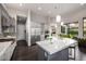 Open-concept kitchen with quartz countertops, stainless steel appliances, and ample cabinet space at 18502 N 98Th Way, Scottsdale, AZ 85255