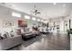 Spacious living room with modern furnishings, an open layout, and abundant natural light at 18502 N 98Th Way, Scottsdale, AZ 85255