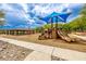 Community playground featuring a variety of play structures, slides, and shaded seating areas at 18502 N 98Th Way, Scottsdale, AZ 85255