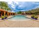 A large community pool is surrounded by inviting cabanas and lounge chairs at 18502 N 98Th Way, Scottsdale, AZ 85255