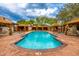 A pristine pool with cabanas offers residents a resort-style relaxation experience at 18502 N 98Th Way, Scottsdale, AZ 85255
