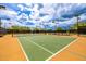 Well-maintained tennis court with lighting and manicured landscaping at 18502 N 98Th Way, Scottsdale, AZ 85255