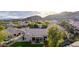 Aerial view of the backyard, patio, pool, and lush landscaping of the desert home at 2040 E Indigo Brush Rd, Phoenix, AZ 85048