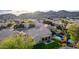 Aerial view of the backyard, patio, pool, and lush landscaping of the desert home at 2040 E Indigo Brush Rd, Phoenix, AZ 85048