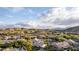Scenic aerial view of luxury homes nestled within the desert landscape, showcasing the beautiful surroundings at 2040 E Indigo Brush Rd, Phoenix, AZ 85048