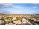 Expansive aerial view of a residential neighborhood with desert landscaping and mountain views at 2040 E Indigo Brush Rd, Phoenix, AZ 85048