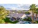 Backyard aerial view with covered patio, pool and lush landscaping of this beautiful desert home at 2040 E Indigo Brush Rd, Phoenix, AZ 85048